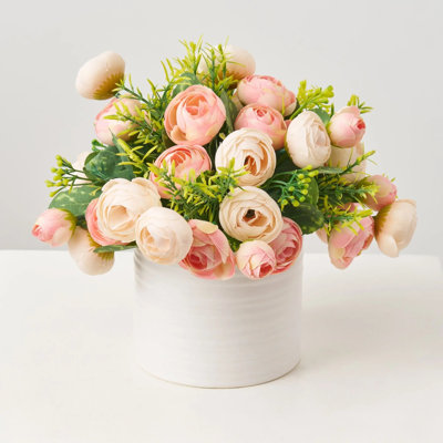 Arrangement floral printanier mélangé rose et rosé dans un vase cylindrique blanc texturé