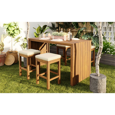 Barre de salle à manger en bois 5 pièces avec quatre tabourets et coussins amovibles beiges, idéale pour la détente sur le balcon