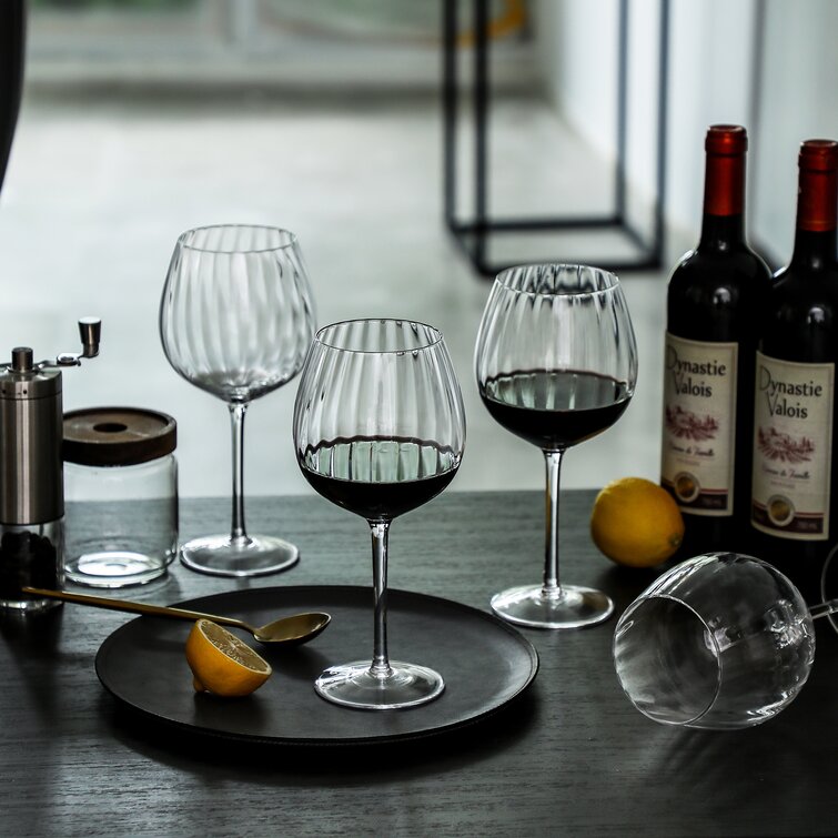 https://assets.wfcdn.com/im/91801266/resize-h755-w755%5Ecompr-r85/1656/165655708/Mikles+Ribbed+23+oz.+Red+Wine+Glass.jpg