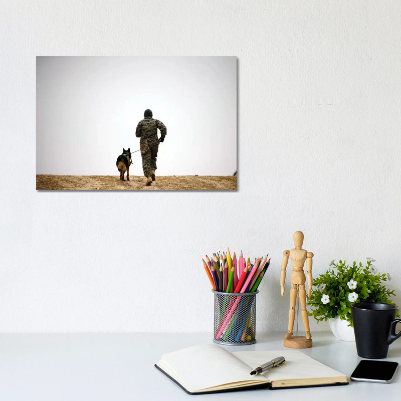 A Dog Handler And His Military Working Dog Take A Brisk Walk - Wrapped Canvas Print, 20.32 cm H x 30.48 cm W