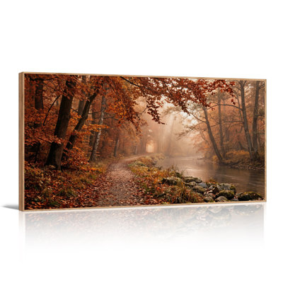 Sunlit Autumn Forest Path Along River Canvas Wall Art