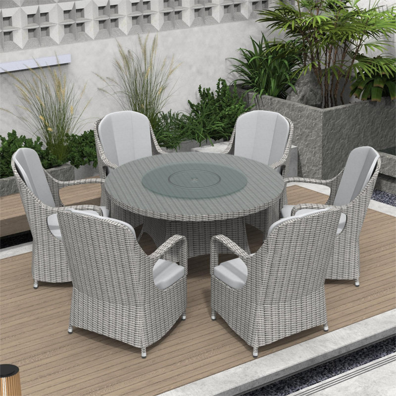 Dustion 6 - Person Wicker Patio Dining Set with Round Table , Cushions Included