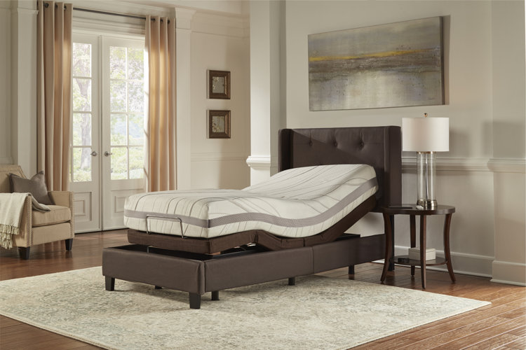 adjustable twin bed with a brown upholstered bed frame in a traditional room