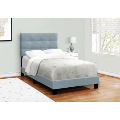Structure de lit simple en velours bleu pour une chambre à coucher glamour