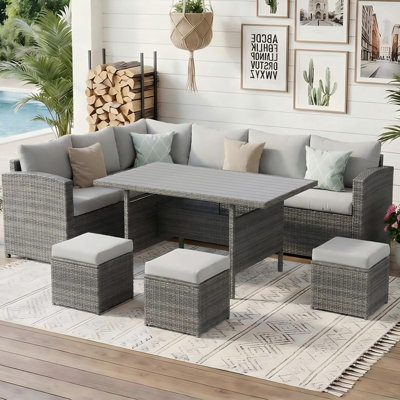 Cueva 7 Piece Rattan Sectional Seating Group with Cushions and Storage
