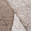 Tapis bordé de motifs géométriques et de contours découpés en beige brun-1749438932