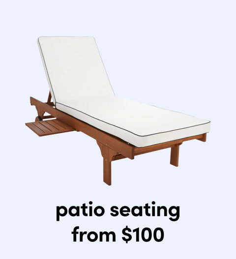 A wooden outdoor chaise lounge chair with a thick white cushion and a small pull-out side table from $100.