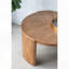 Table basse ronde avec pieds incurvés