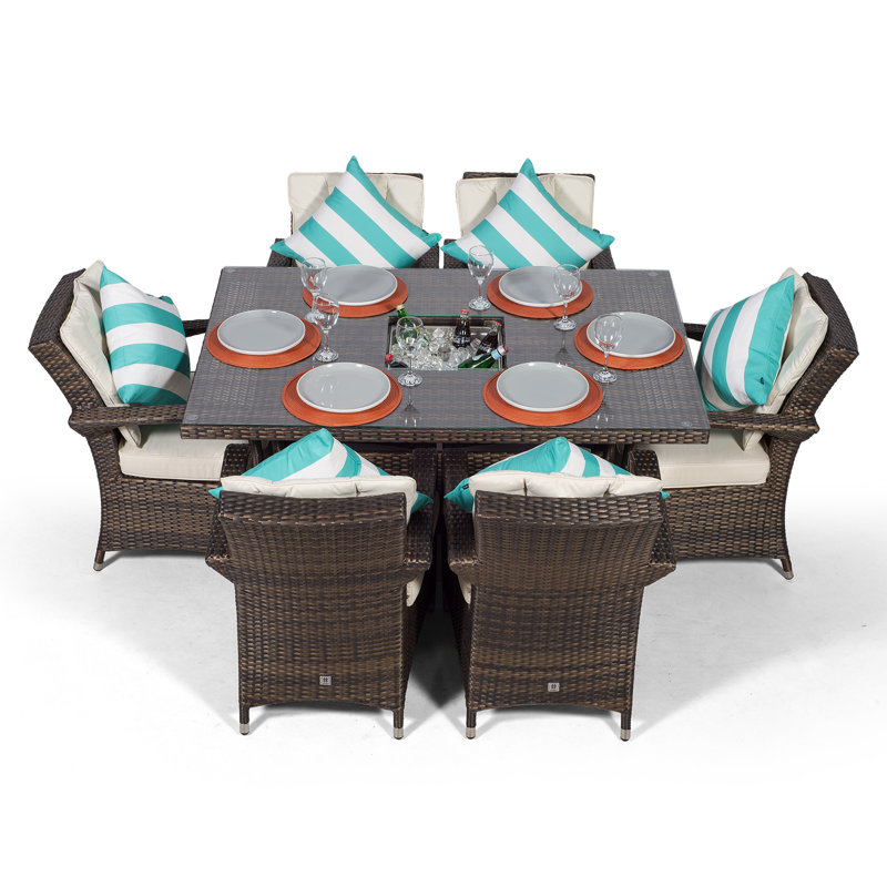 Karas 6 - Person Wicker Patio Dining Set with Rectangular Table , Cushions Included, Brown