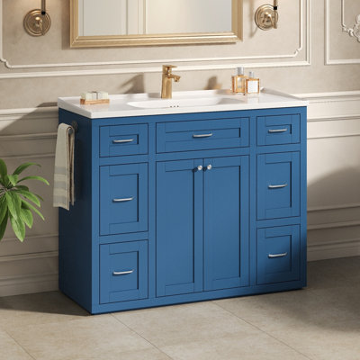 Meuble-lavabo bleu marine 48 po avec lavabo en céramique - 6 tiroirs (3 de chaque côté), tiroir central rabattable, portes doubles à fermeture en douceur, porte-serviettes latéral réversible, poignées argentées, panneau de fibres à densité moyenne