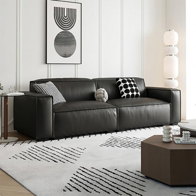 Causeuse-coussin modulable noire en cuir véritable