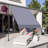 Versatile Retractable Patio Awning with UV Protection and Multiple Functionalities