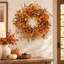 Couronne artificielle d'automne avec baies de citrouille et feuilles de chêne pour la porte d'entrée