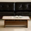 Table basse beige en pierre et bois de noyer
