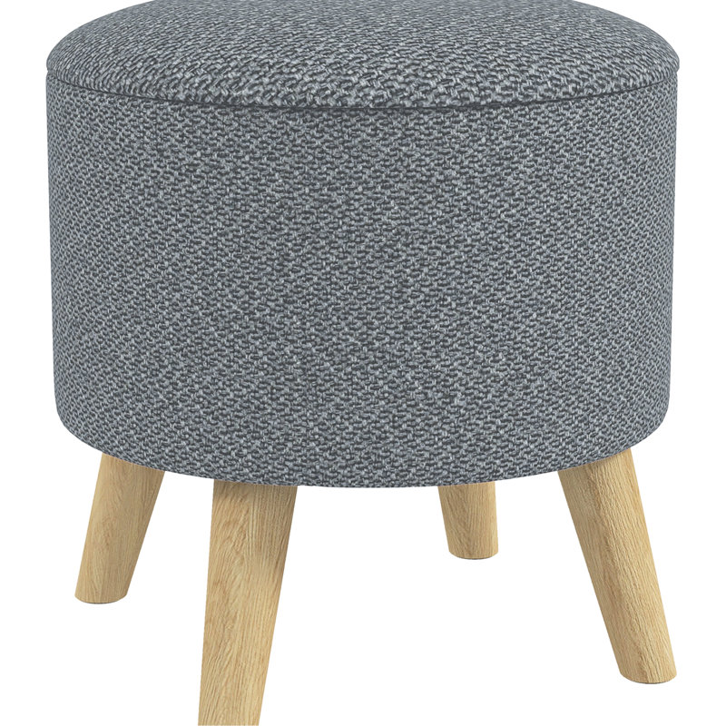 Tabouret gris avec rangement et structure stable autour d'un espace caché