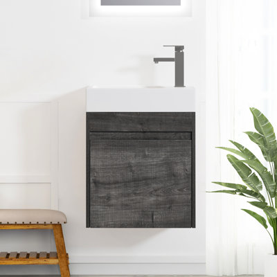 Meuble-lavabo mural de 18 po de style moderne avec lavabo en résine blanche, fonction de fermeture en douceur et composition en contreplaqué installé dans une armoire à carreaux fermés d'aspect chêne gris pour un espace élégant