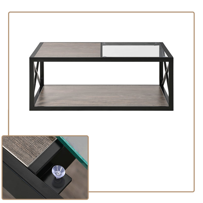 Table basse rectangulaire de style industriel avec structure en métal, plateau en demi-verre et composite de grain de bois, tablette de rangement inférieure.