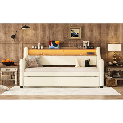 Lit de jour simple avec lit gigogne, rembourré en blanc, charge et effets d'éclairage à DEL pour une chambre à coucher confortable