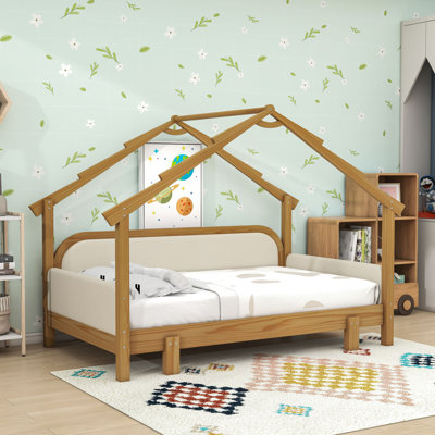 Lit en bois avec barrières rembourrées