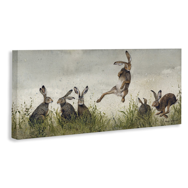 Jumping Hares in Wild Canvas Wall Art by Maggie Vandewalle, 13" H x 30" W