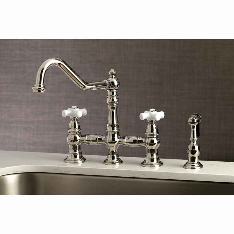 Kingston Brass Restoration Two-Handle 4-Hole Deck Mount Bridge Kitchen Faucet with Brass Side Sprayer, Polished Nickel