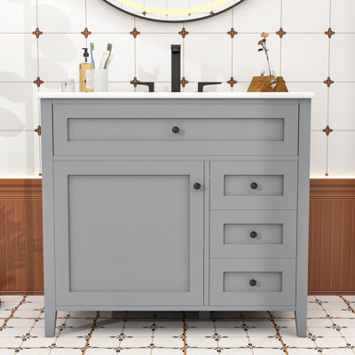 Meuble-lavabo autoportant moderne avec lavabo en céramique lisse, tablettes réglables et tiroirs de rangement