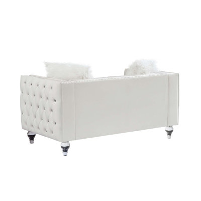Canapé confortable à deux places avec coussins moelleux et design élégant pour la détente