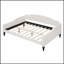 Lit de jour rembourré capitonné avec tissu en lin durable et design à oreilles élégant pour des espaces de vie polyvalents