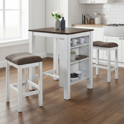 A Three-piece Dining Set Designed For Compact Spaces, Featuring One Table And Two Stools.