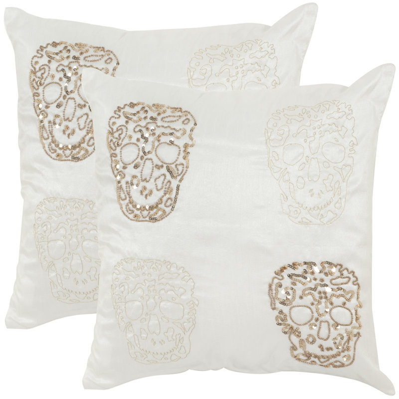 Coussin quatre crâne