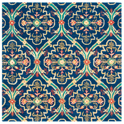 Drihmi Hand Tufted Wool/Cotton Geometric Rug in Green/Navy/Yellow