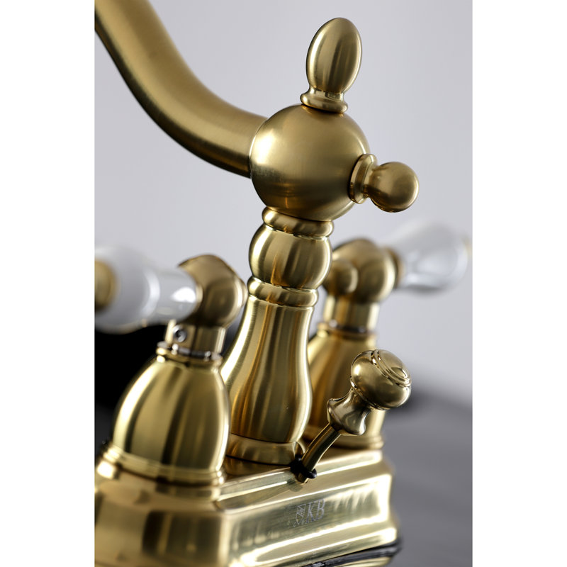 Kingston Brass Heritage Two-Handle 3-Hole Deck Mount 4" Centerset Bathroom Faucet with Plastic Pop-Up, Brushed Brass