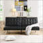 Élégant canapé-lit futon en PVC noir avec structure en bois et pieds en acier inoxydable, parfait pour les intérieurs modernes et traditionnels.