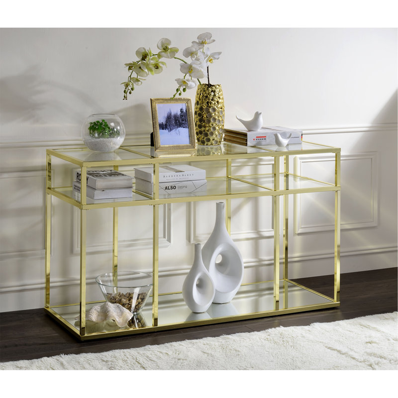 Table de canapé en verre transparent et finition dorée