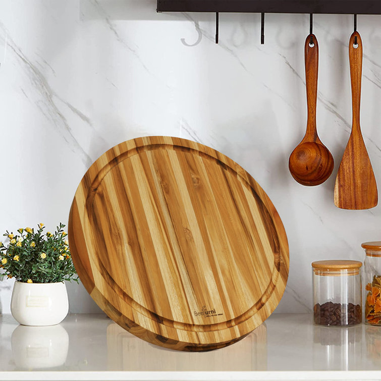 https://assets.wfcdn.com/im/92102294/resize-h755-w755%5Ecompr-r85/2084/208489910/15.75In+Round+Cutting+Boards+With+Juice+Groove%2C+Real+Teak+Boards+For+Serving+Fancy+Breakfast%2C+Lunch%2C+Dinner.jpg