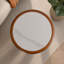 Table basse ronde en pierre frittée de 19,69 pouces avec bordure en bois massif et pieds de colonne en panneau de fibres à densité moyenne. Style moderne et minimaliste, adapté aux salons et aux appartements.