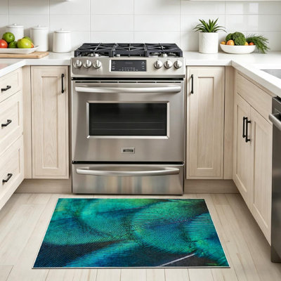 Tapis bleu à motif de plumes de paon