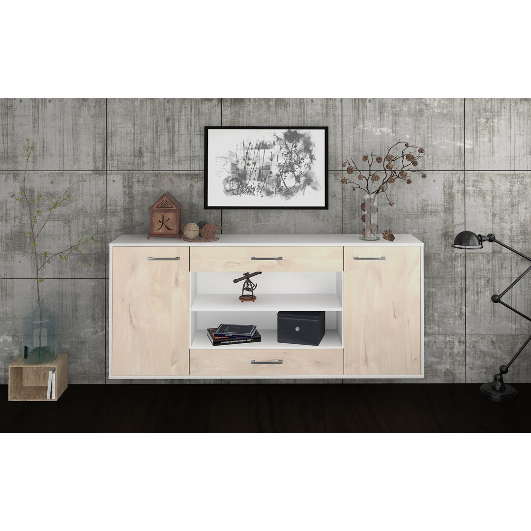 Das Sideboard Mussab hat Metallgriffe. Es hat die Maße 180 cm x 79 cm x 35 cm.