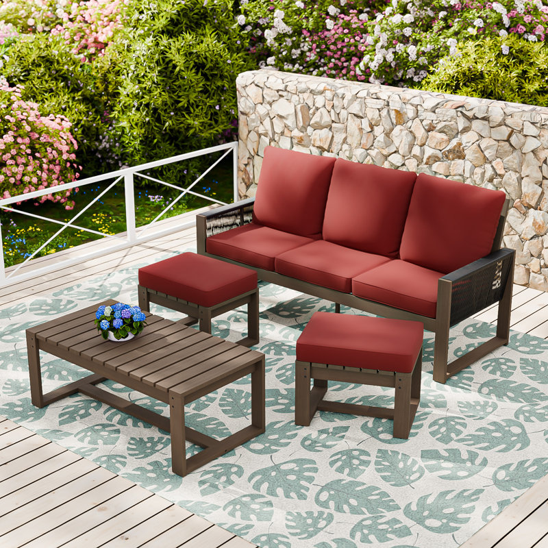 Ensemble de conversation d'extérieur en bois de cèdre 4 pièces avec canapé 3 places avec coussins en oléfine, table basse rectangulaire, repose-pieds