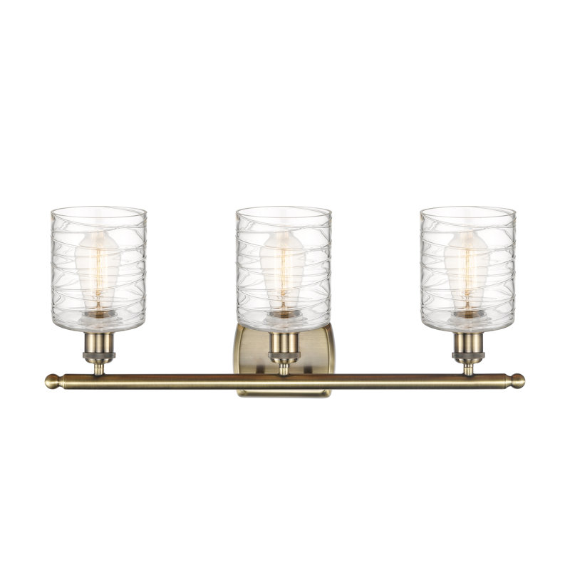 Leilani 3 - Light Dimmable Vanity Light, 60 Watt Vintage Incandescent Bulb, Antique Brass, Clear Deco Swirl