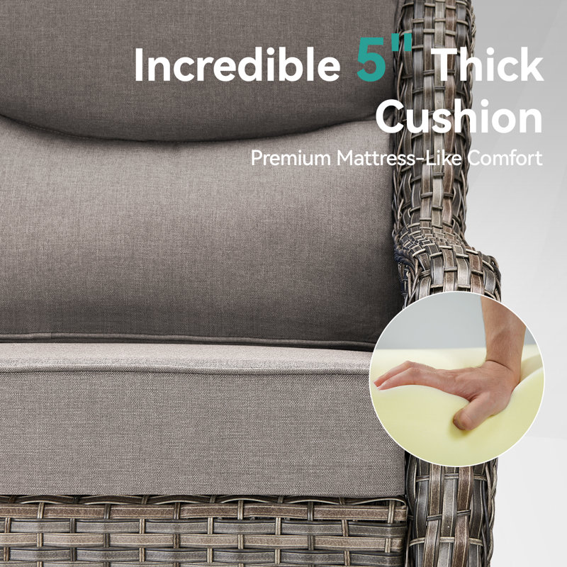 Gray Wicker Swivel Glider Chair with Beige Cushions and Fire Pit Table