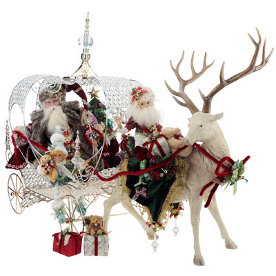 Père Noël féerique avec cerf et chariot