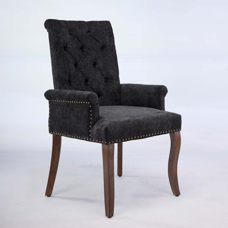 Élégante chaise de salle à manger rembourrée en chenille avec pieds en bois courbés et conception capitonnée, parfaite pour le confort et le style dans n'importe quelle pièce