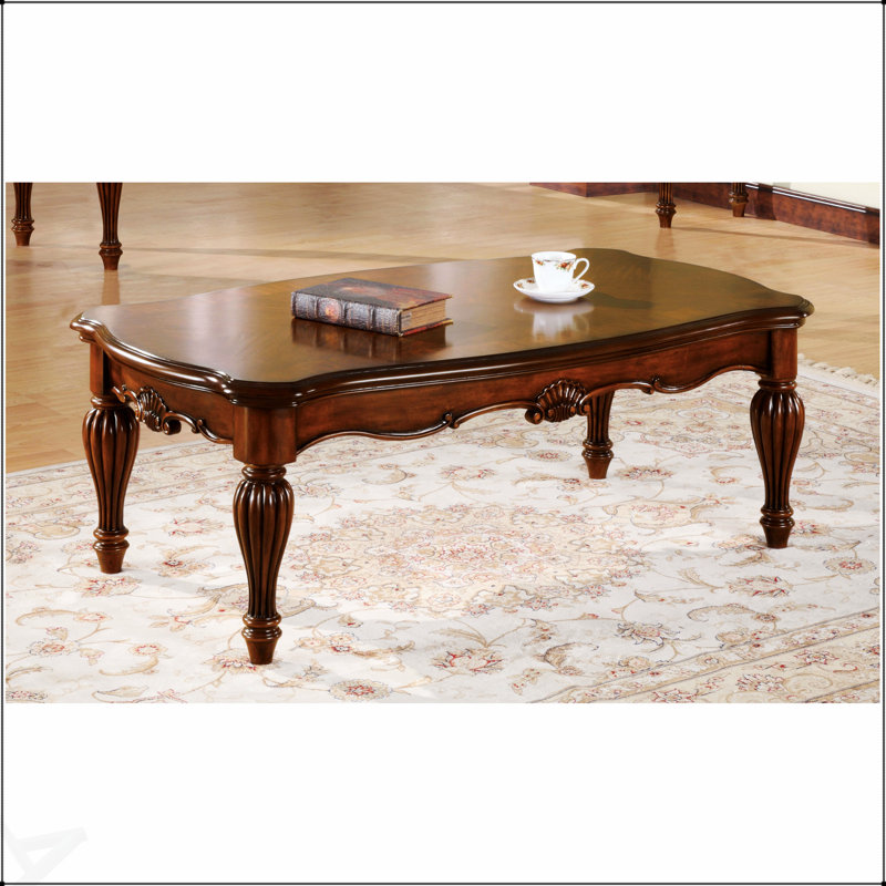 Table basse en cerisier rectangulaire avec pieds tournés, élégance intemporelle et grande surface pour le décor et la fonctionnalité.