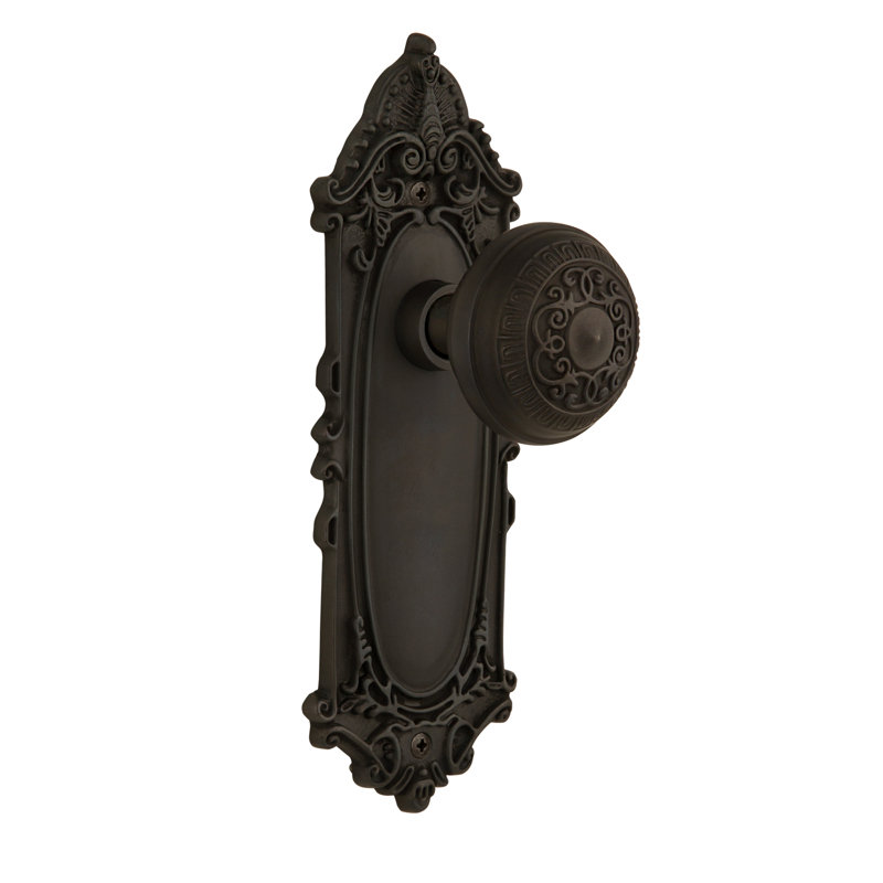 Plaque victorienne avec bouton de porte œuf et fléchettes, Bronze frotté à l'huile