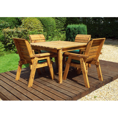 Felder 4 - Person Solid Wood Patio Dining Set Umbrella Hole Included Square Table with Cushions Included