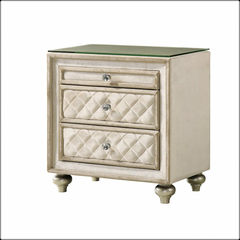 Élégante table de chevet à 2 tiroirs avec un design capitonné et des boutons en cristal, parfaite pour ajouter du luxe à n'importe quelle chambre à coucher.