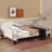 A Full-Size Upholstered Daybed With Tufted Detailing