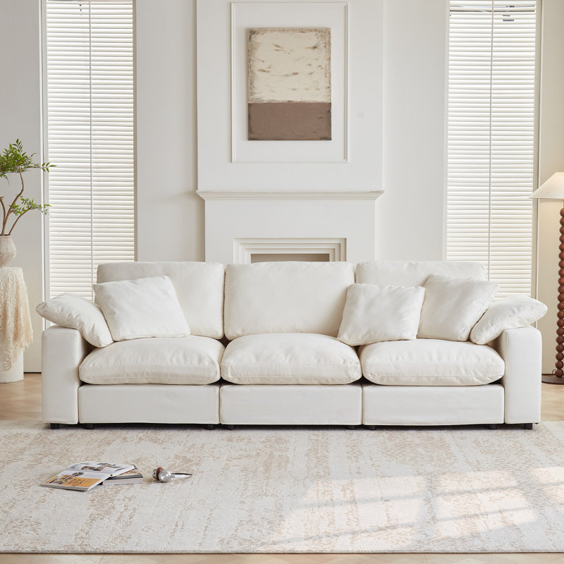 Canapé d'angle modulaire Cloud Couch, confort optimal. Sans compression sous vide. Garnissage en duvet et coton. Housses lavables - 3 places, blanc cassé.