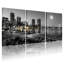 Ensemble de 3 tableaux sur toile tendue représentant un paysage urbain nocturne au clair de lune, en noir et blanc.-276160380
